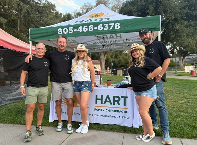 Jon Wells And Oscar Castro smiling With their Team